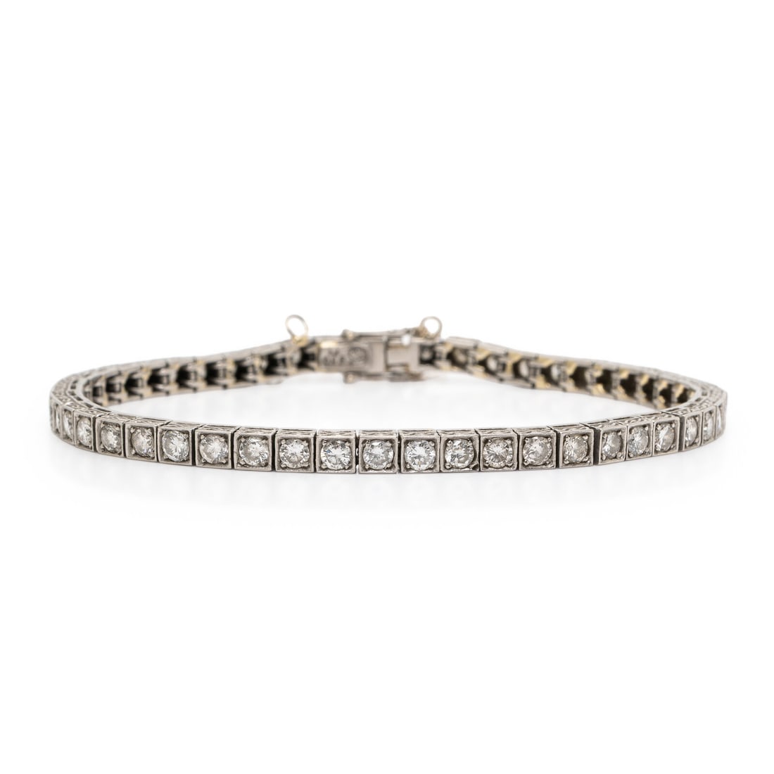 Platinum and Diamond Line Bracelet: Platinum and Diamond Line Bracelet Round brilliant cut diamonds weighing approximately 3.95 carats total. Platinum. 7 inches long. Stamp: 950 Pt (maker's mark). Gross weight: 13.80 dwt.