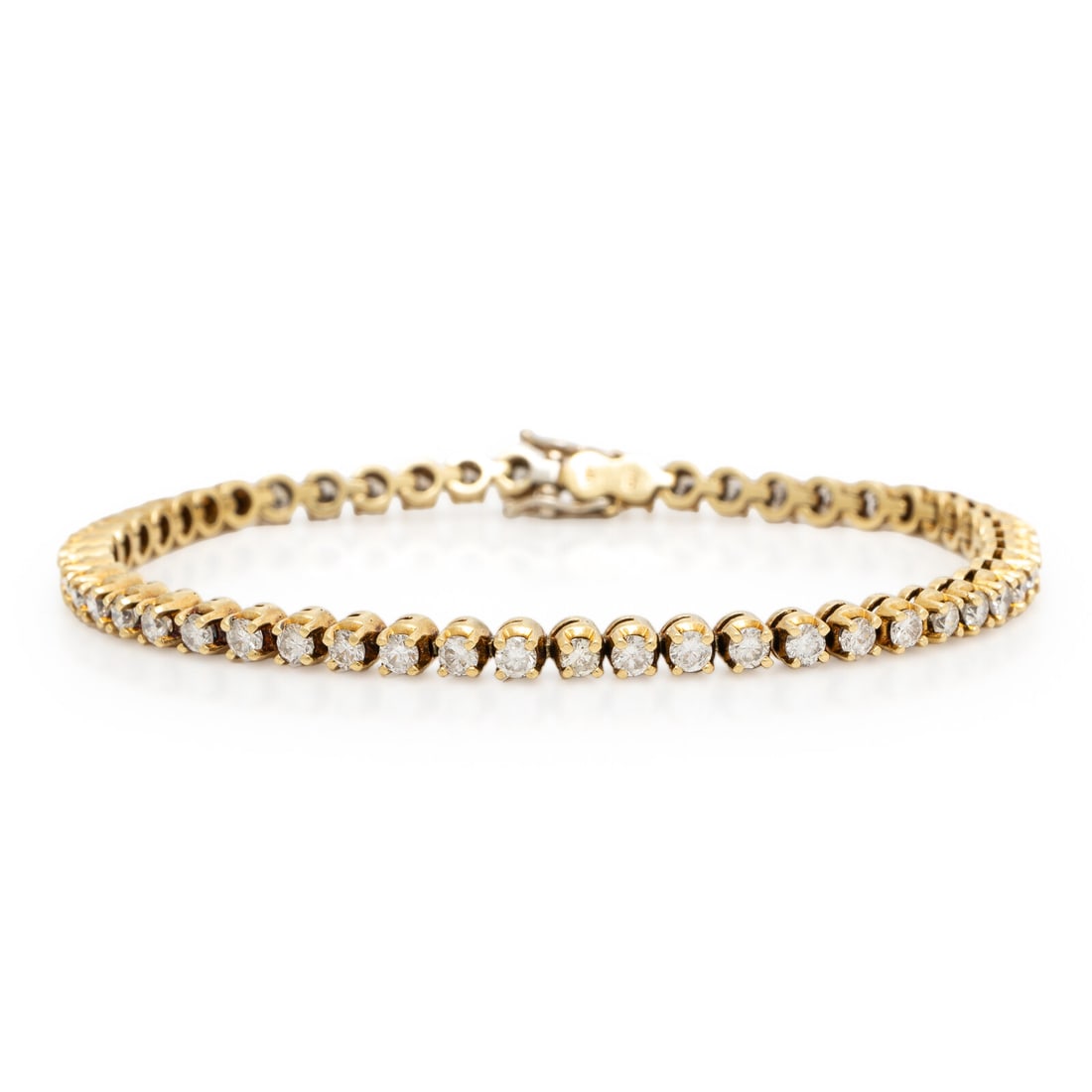 Yellow Gold and Diamond Tennis Bracelet: Yellow Gold and Diamond Tennis Bracelet Round brilliant cut diamonds weighing approximately 3.00 carats total. 14 karat yellow gold. 6 7/8 inches. Stamp: 14K 585. Gross weight: 7.00 dwt. Property from