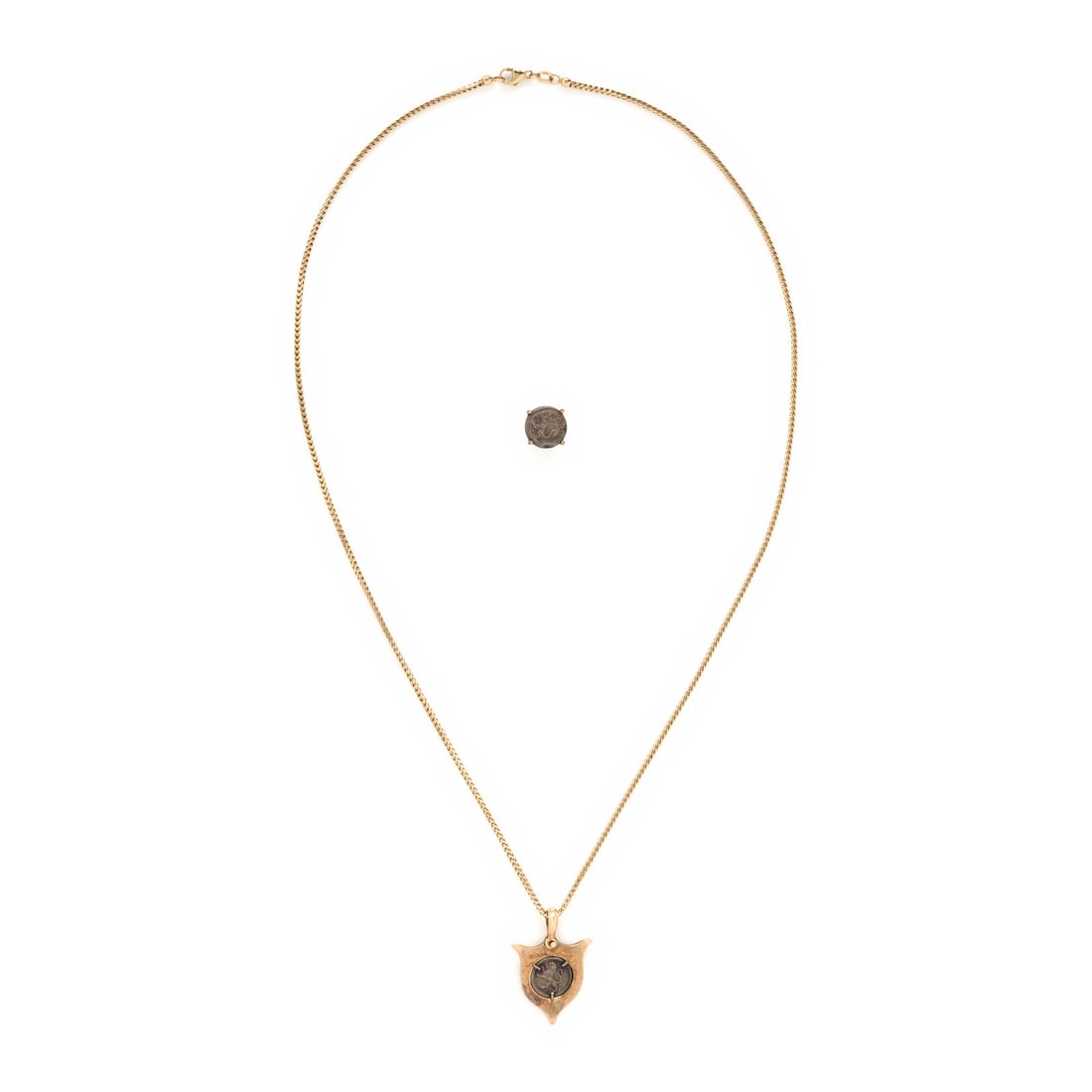 Silver Coin and Yellow Gold Necklace and Earring: Silver Coin and Yellow Gold Necklace and Earring The single earring and the pendant each set with a silver coin marked 1892 and 1888 respectively. Silver, 18 karat yellow gold, 14 karat yellow gold, a