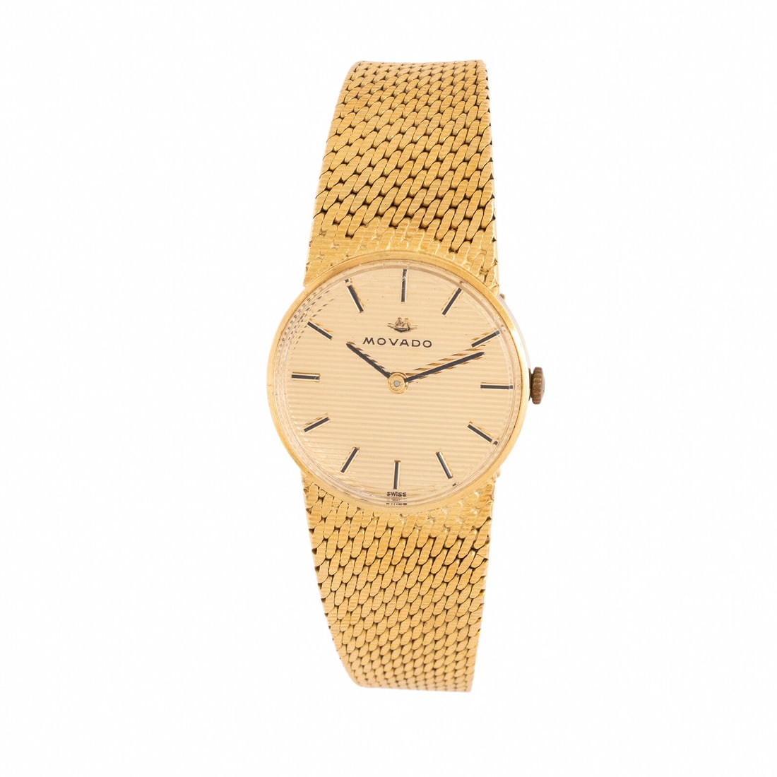 Movado, Yellow Gold Watch: Movado, Yellow Gold Watch Maker: Movado Year: Circa 1980s Case size: Approx. 24 mm Case material: Yellow gold Dial: Champagne Movement: Manual wind Bracelet/Strap: 18K yellow gold Stamps: Bracelet: (M