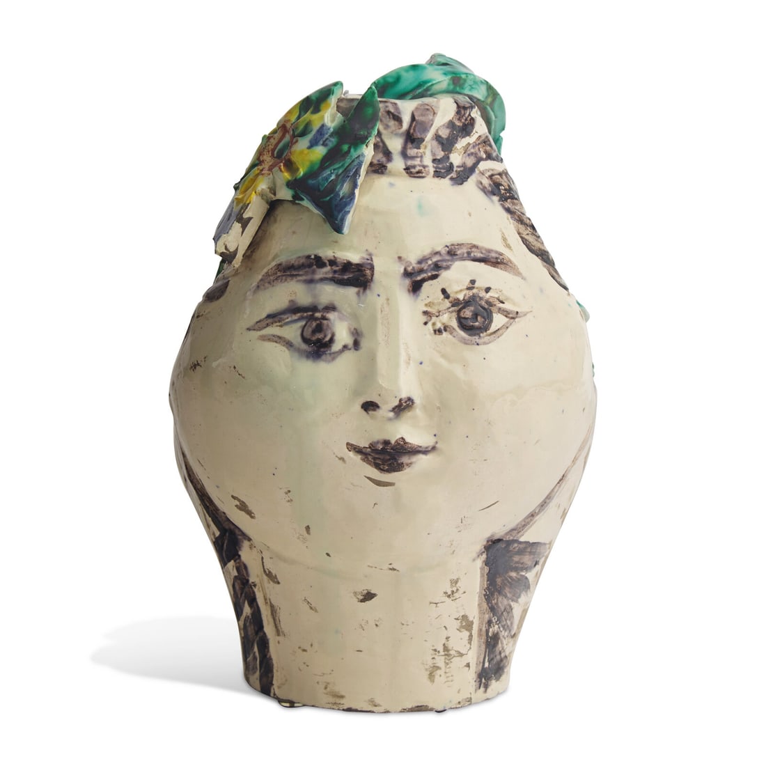 Pablo Picasso (Spanish, 1881-1973) Tête de Femme Couronnée de Fleurs (Pichet), Unique: Pablo Picasso (Spanish, 1881-1973) Tête de Femme Couronnée de Fleurs (Pichet), Unique Ceramic, 1954 painted and glazed terracotta dated 20.3.54 (lower right); with Madoura and Empreinte Orig