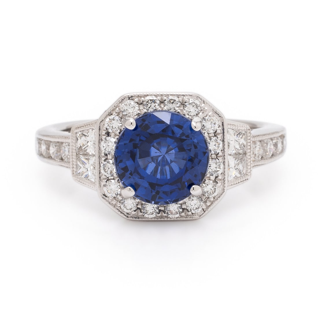 Synthetic Sapphire, Diamond, and White Gold Ring: Synthetic Sapphire, Diamond, and White Gold Ring Round synthetic sapphire measuring approximately 7.95 x 8.05 mm, and round brilliant and princess calibré-cut diamonds weighing approximately 0.75