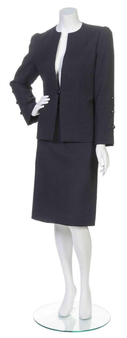 A Galanos Black Skirt Suit,: A Galanos Black Skirt Suit, comprised of a single button jacket with topstitched trim, together with a straight skirt. Labeled: Galanos. Property from the Estate of Betsy Pickering Kaiser