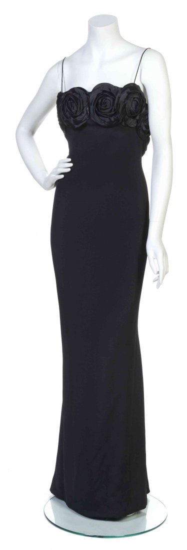 A Galanos Black Crêpe Evening Gown,: A Galanos Black Crêpe Evening Gown, spaghetti straps, with satin rossette detail to the bust. Labeled: Galanos sample. Property from the Estate of Betsy Pickering Kaiser