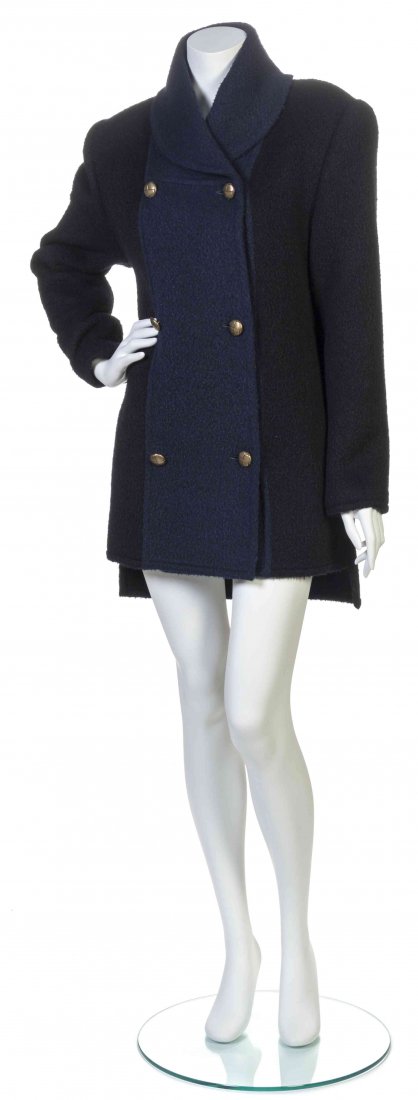 A Galanos Black and Blue Wool Coat,: A Galanos Black and Blue Wool Coat, double breasted with a shawl collar, center front blue wool contrast panel, longer in back. Labeled: Galanos. Property from the Estate of Betsy Pickering Kaiser
