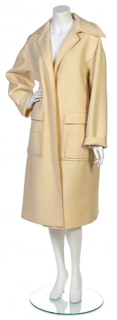 A Galanos Cream Melton Wool Coat,: A Galanos Cream Melton Wool Coat, open front with two patch pockets. Labeled: Galanos. Property from the Estate of Betsy Pickering Kaiser