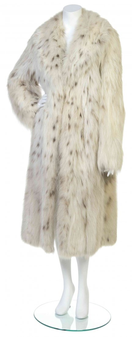 A Halston White Fur Coat,: A Halston White Fur Coat, two hook and eye closures to the center front. Labeled: Halston. Property from the Estate of Betsy Pickering Kaiser