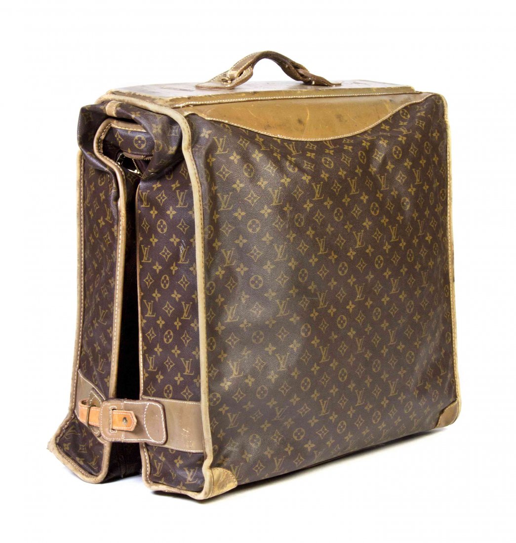 A Louis Vuitton Monogram Canvas Bi-Fold Suitcase, 22 x: A Louis Vuitton Monogram Canvas Bi-Fold Suitcase, single handle, leather top. 22 x 22 x 11 inches. Property from the Estate of Betsy Pickering Kaiser