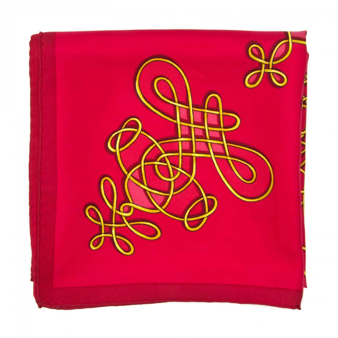 An Hermès Silk Scarf, 35 x 35 inches.: An Hermès Silk Scarf, in a gold filigree motif. Labeled within print: Hermès. 35 x 35 inches. Property from the Estate of Betsy Pickering Kaiser