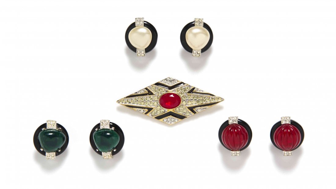 A Group of Kenneth Jay Lane Costume Jewelry,: A Group of Kenneth Jay Lane Costume Jewelry, comprised of three pairs of black resin, rhinestone and cabochon earclips together with a black enamel, rhinestone and faux ruby cabochon diamond shaped br