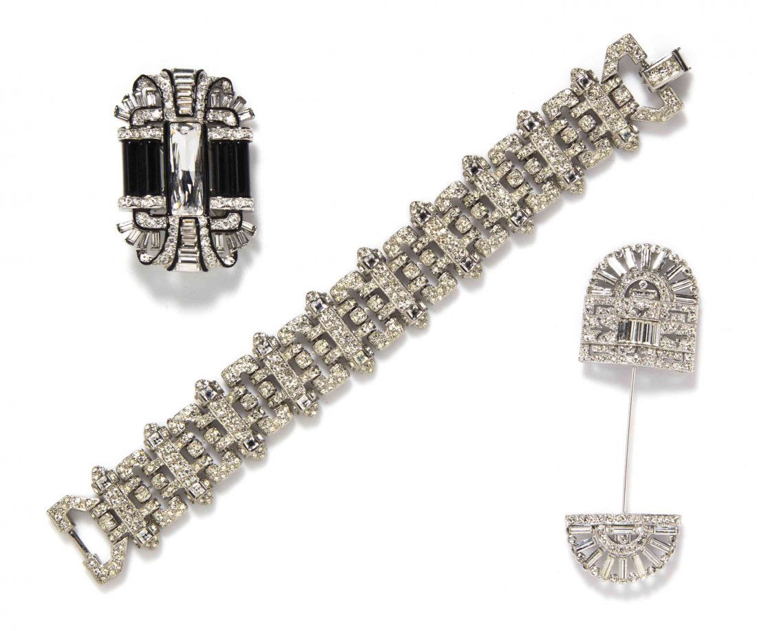 A Group of Kenneth Jay Lane Art Deco Costume Jewelry,: A Group of Kenneth Jay Lane Art Deco Costume Jewelry, comprised of a rhinestone and crystal baguette jabot brooch, a black enamel and crystal baguette brooch, and a crystal and rhinestone chain link b