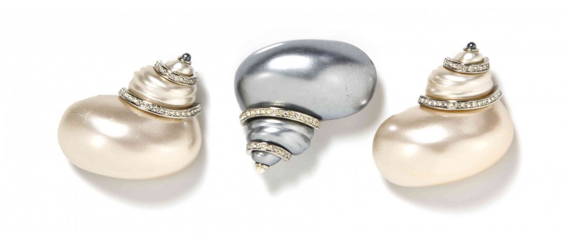 A Group of Kenneth Jay Lane Silvertone Brooches,: A Group of Kenneth Jay Lane Silvertone Brooches, comprised of three sea shell brooches with rhinestone accents. All stamped: Kenneth Jay Lane. Property from the Estate of Betsy Pickering Kaiser