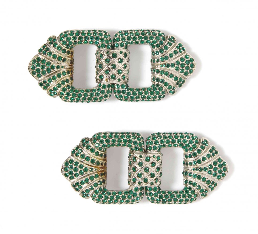 A Pair of Ciner Faux Emerald Silvertone Brooches,: A Pair of Ciner Faux Emerald Silvertone Brooches, in a decorative buckle motif. Stamped: Ciner. Property from the Estate of Betsy Pickering Kaiser