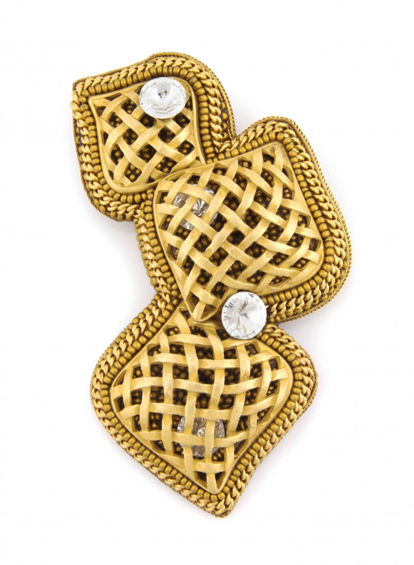 A Galanos Goldtone Brooch,: A Galanos Goldtone Brooch, in a basket weave relief with a chain link and ball chain frame and four crystal accents. Stamped: AMD for Galanos. Property from the Estate of Betsy Pickering Kaiser