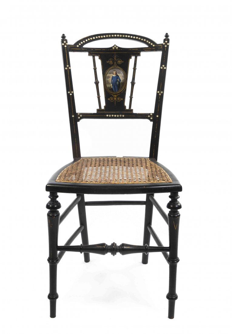 A Victorian Porcelain Inset and Ebonized Side Chair,: A Victorian Porcelain Inset and Ebonized Side Chair, having a curved crest rail over the vertical splat centered with a roundel painted with a gentleman, above the trapezoidal caned seat, raised on ta