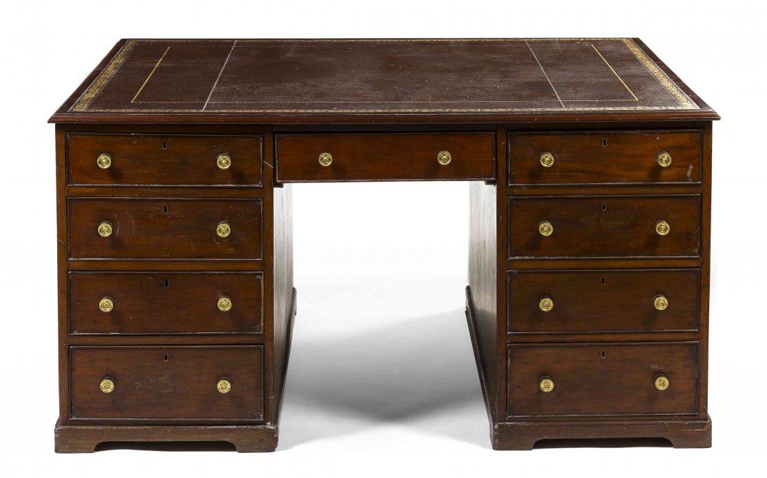 A George III Mahogany Partner's Pedestal Desk, Height: A George III Mahogany Partner's Pedestal Desk, 19th century, having a rectangular tooled leather inset top over twin pedestals, set with opposing drawers, raised on bracket feet. Height 31 x width 60 