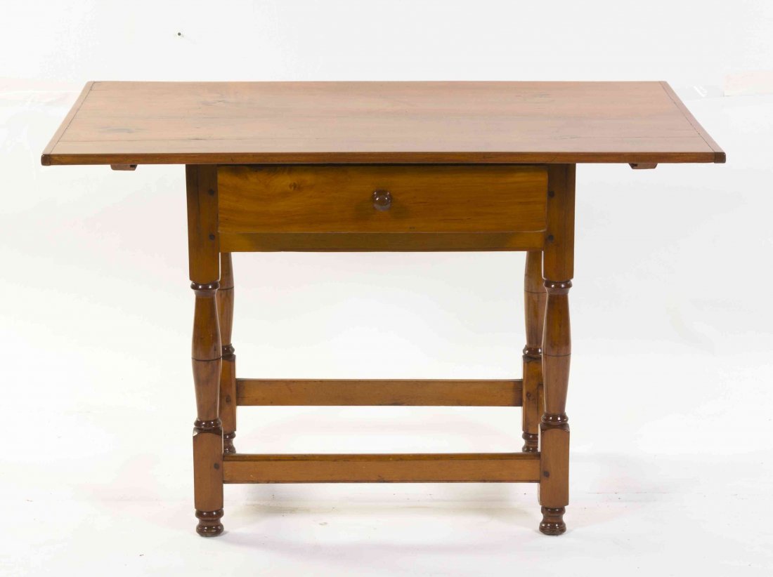 An American Pine Work Table, Height 26 x width 41 x: An American Pine Work Table, having a rectangular top over a single drawer, raised on turned legs, joined by stretchers, likely reduced. Height 26 x width 41 x depth 26 1/2 inches. Property from the E