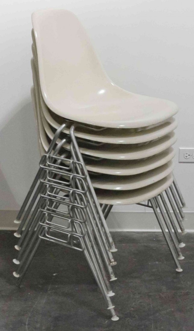 A Group of Six Charles and Ray Eames Chairs, Height 31: A Group of Six Charles and Ray Eames Chairs, white and raised on tubular legs. Height 31 inches. Property from the Collection of the Milwaukee Public Library, Milwaukee Wisconsin