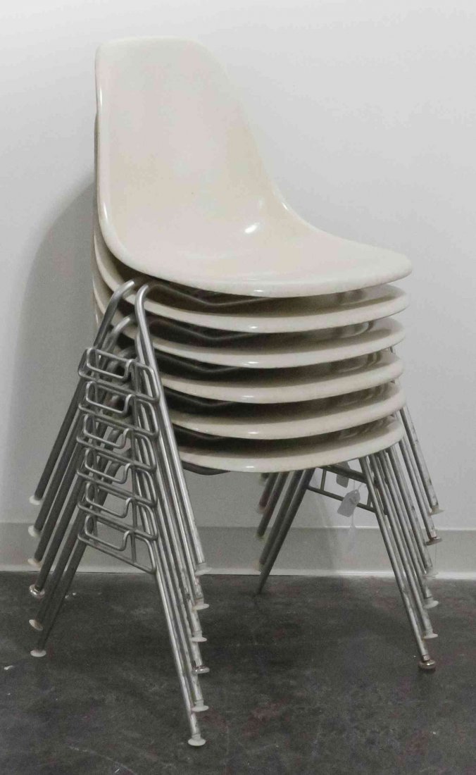 A Group of Six Charles and Ray Eames Chairs, Height 31: A Group of Six Charles and Ray Eames Chairs, white and raised on tubular legs. Height 31 inches. Property from the Collection of the Milwaukee Public Library, Milwaukee Wisconsin