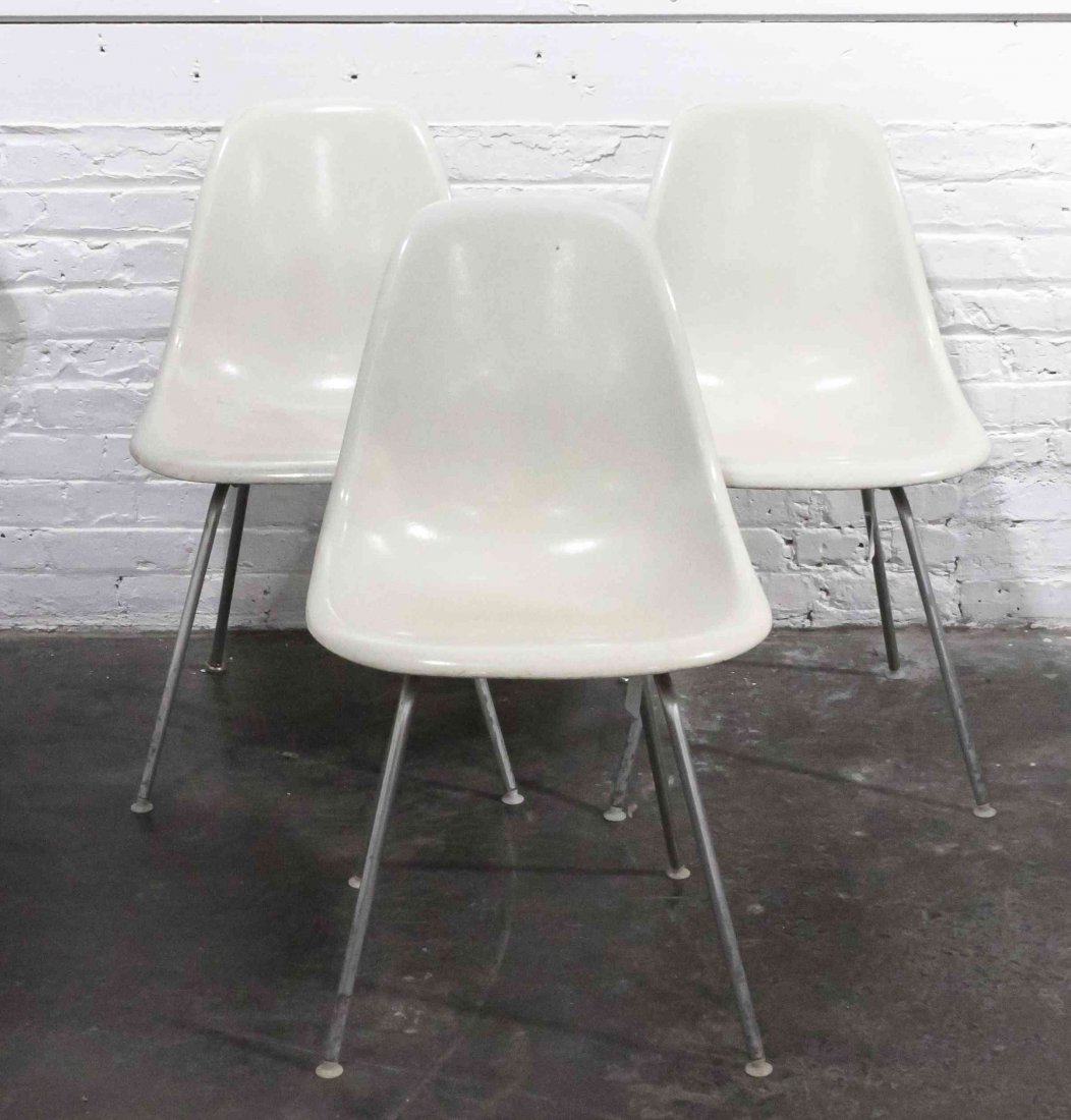A Group of Six Charles and Ray Eames Chairs, Height 31: A Group of Six Charles and Ray Eames Chairs, white and raised on tubular legs. Height 31 inches. Property from the Collection of the Milwaukee Public Library, Milwaukee Wisconsin