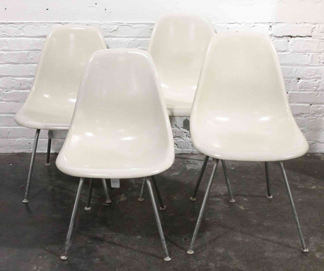 A Group of Four Charles and Ray Eames Chairs, Height 31: A Group of Four Charles and Ray Eames Chairs, white and raised on tubular legs. Height 31 inches. Property from the Collection of the Milwaukee Public Library, Milwaukee Wisconsin