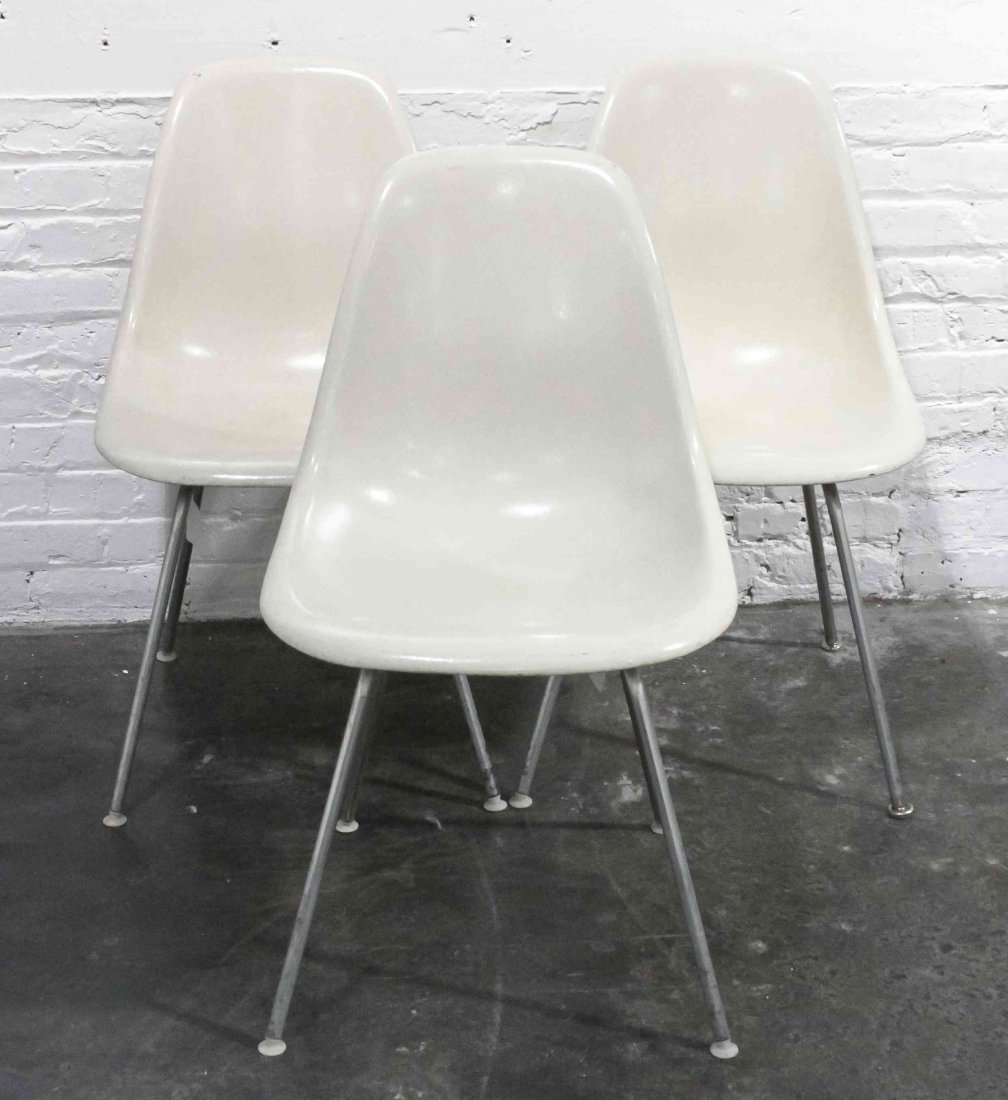A Group of Six Charles and Ray Eames Chairs, Height 31: A Group of Six Charles and Ray Eames Chairs, white and raised on tubular legs. Height 31 inches. Property from the Collection of the Milwaukee Public Library, Milwaukee Wisconsin
