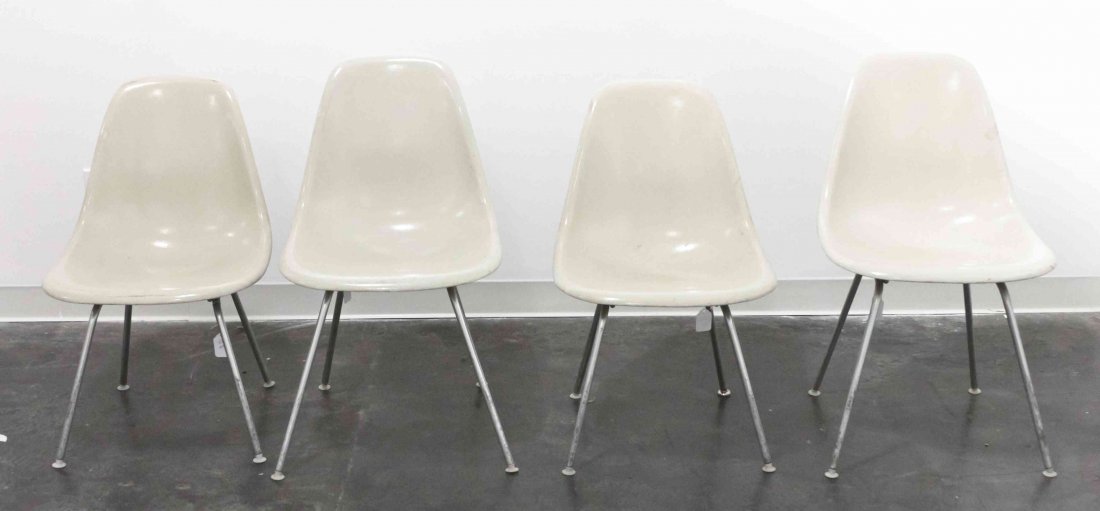 A Group of Four Charles and Ray Eames Chairs, Height 31: A Group of Four Charles and Ray Eames Chairs, white and raised on tubular legs. Height 31 inches. Property from the Collection of the Milwaukee Public Library, Milwaukee Wisconsin