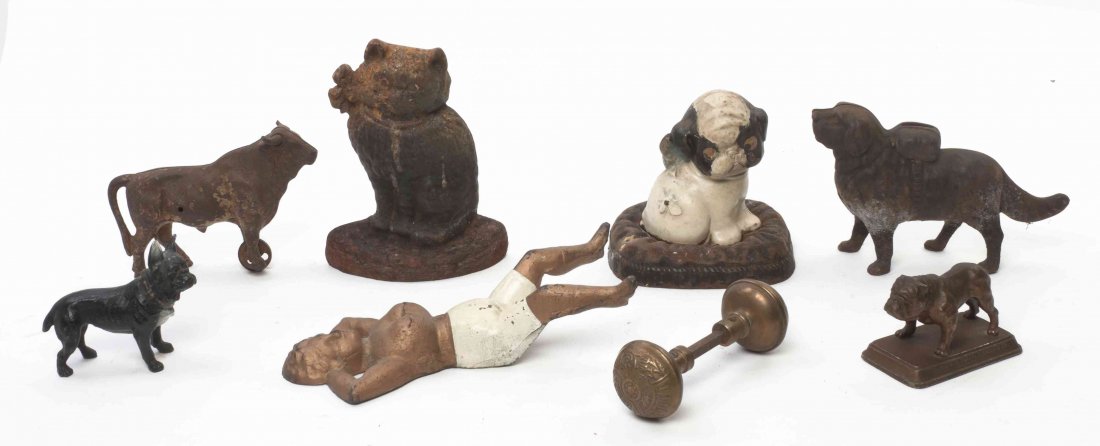 A Collection of Cast Iron Articles, Height of tallest 8: A Collection of Cast Iron Articles, comprising door stops, banks, a boot jack and others; 8 items total. Height of tallest 8 inches. Property from the Estate of Grayce Haning, East Peoria, Illinois