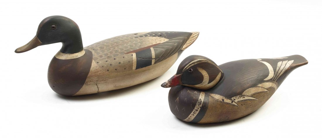 Two Carved and Polychrome Decorated Duck Decoys, T.J.: Two Carved and Polychrome Decorated Duck Decoys, T.J. Hooker, each having glass eyes, stamped T.J.'s Rig and from The Sporting Life, the first numbered 110/250, the second 67/250. Length of longer 16