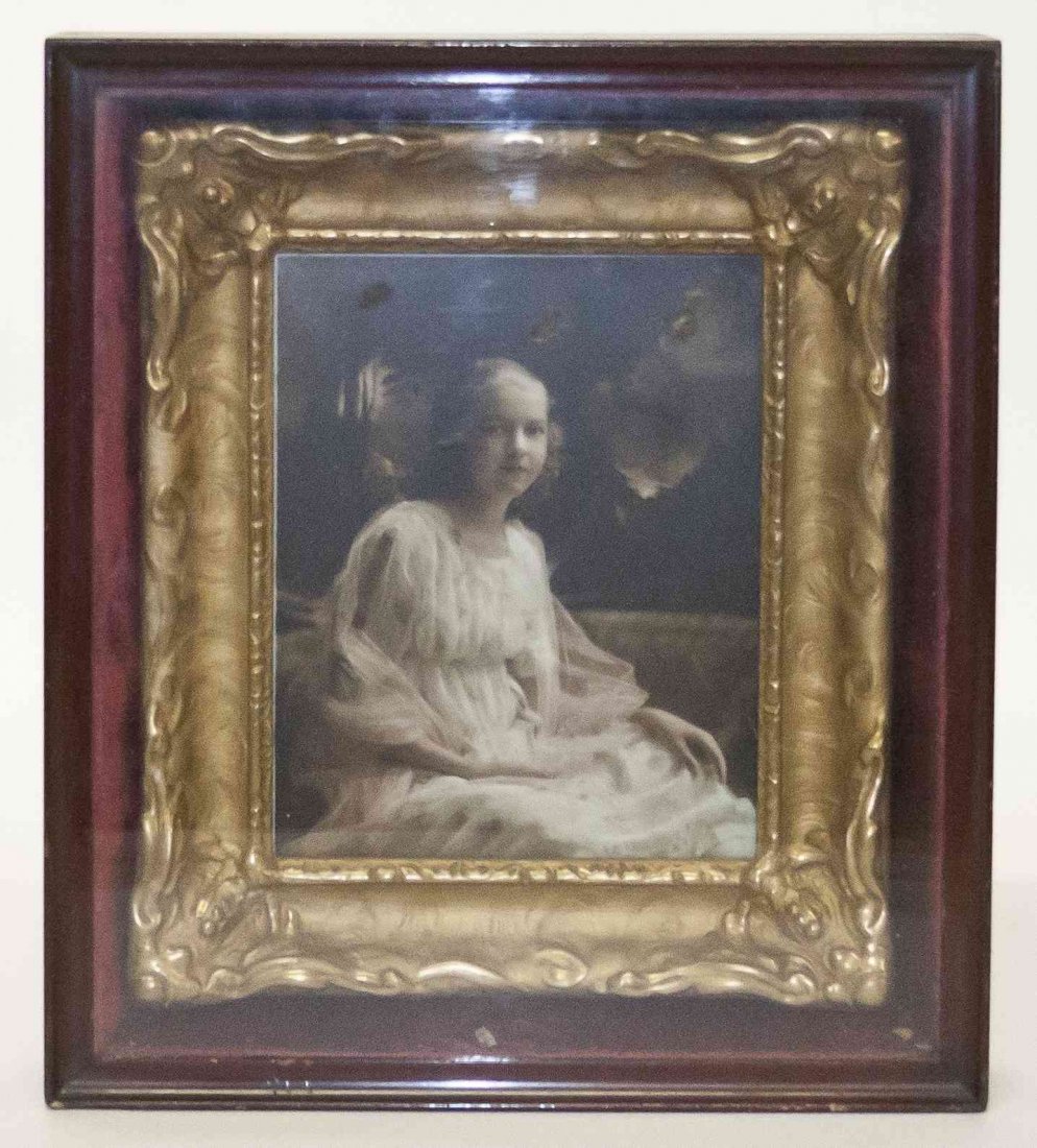 A Continental Photographic Print on Glass, Height 16: A Continental Photographic Print on Glass, depicting a seated young maiden, in a dress with floral print, set in a giltwood frame, further set in a shadow box frame. Height 16 1/2 x width 14 5/8 inche
