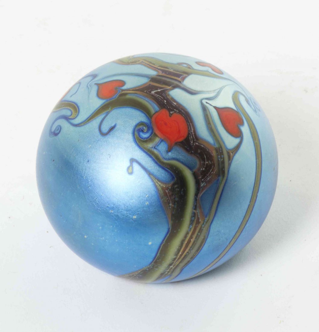 An Orient and Flume Glass Paperweight, Diameter 2 7/8: An Orient and Flume Glass Paperweight, 1976, numbered 987A, of flattened spherical form with pulled iridescent decoration. Diameter 2 7/8 inches.
