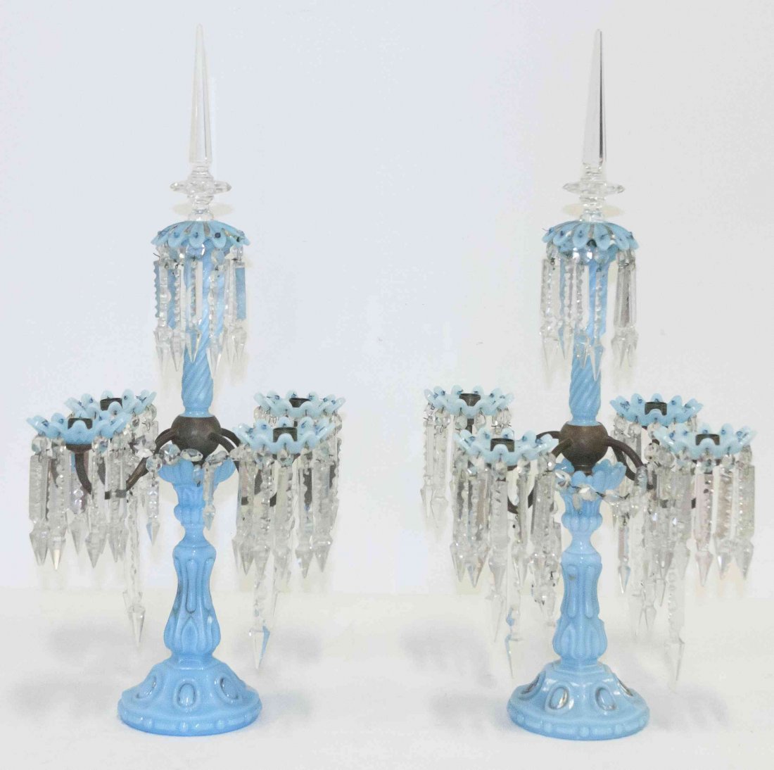 A Pair of Opaline Glass Five-Light Girandoles, Height: A Pair of Opaline Glass Five-Light Girandoles, the twist baluster form standard issuing the S-form candle arms, hung with prisms throughout. Height 18 3/4 inches.