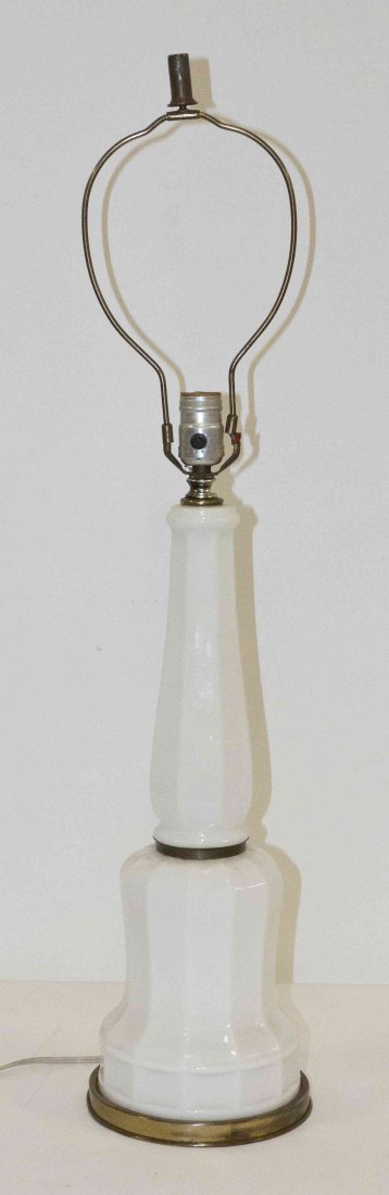 An Opaline Glass Lamp, Height 32 inches (overall).: An Opaline Glass Lamp, of faceted baluster form set on a gilt metal base. Height 32 inches (overall).