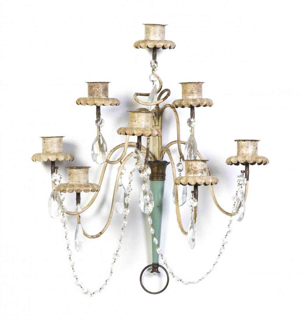 An Italian Tole Eight-Light Sconce, Height 19 inches.: An Italian Tole Eight-Light Sconce, having scrolling candle arms, hung with prisms throughout. Height 19 inches. Property from the Estate of George B. Chapman, Chicago, Illinois