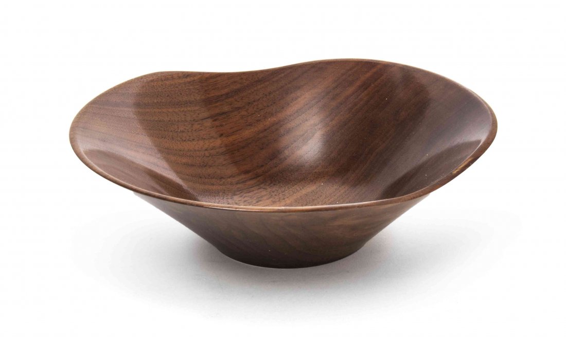 An American Turned Walnut Bowl, Rude Osolnik: An American Turned Walnut Bowl, Rude Osolnik (1915-2001), of low form with an irregular rim, signed Osolnik Original, Walnut. Width 7 3/4 inches.