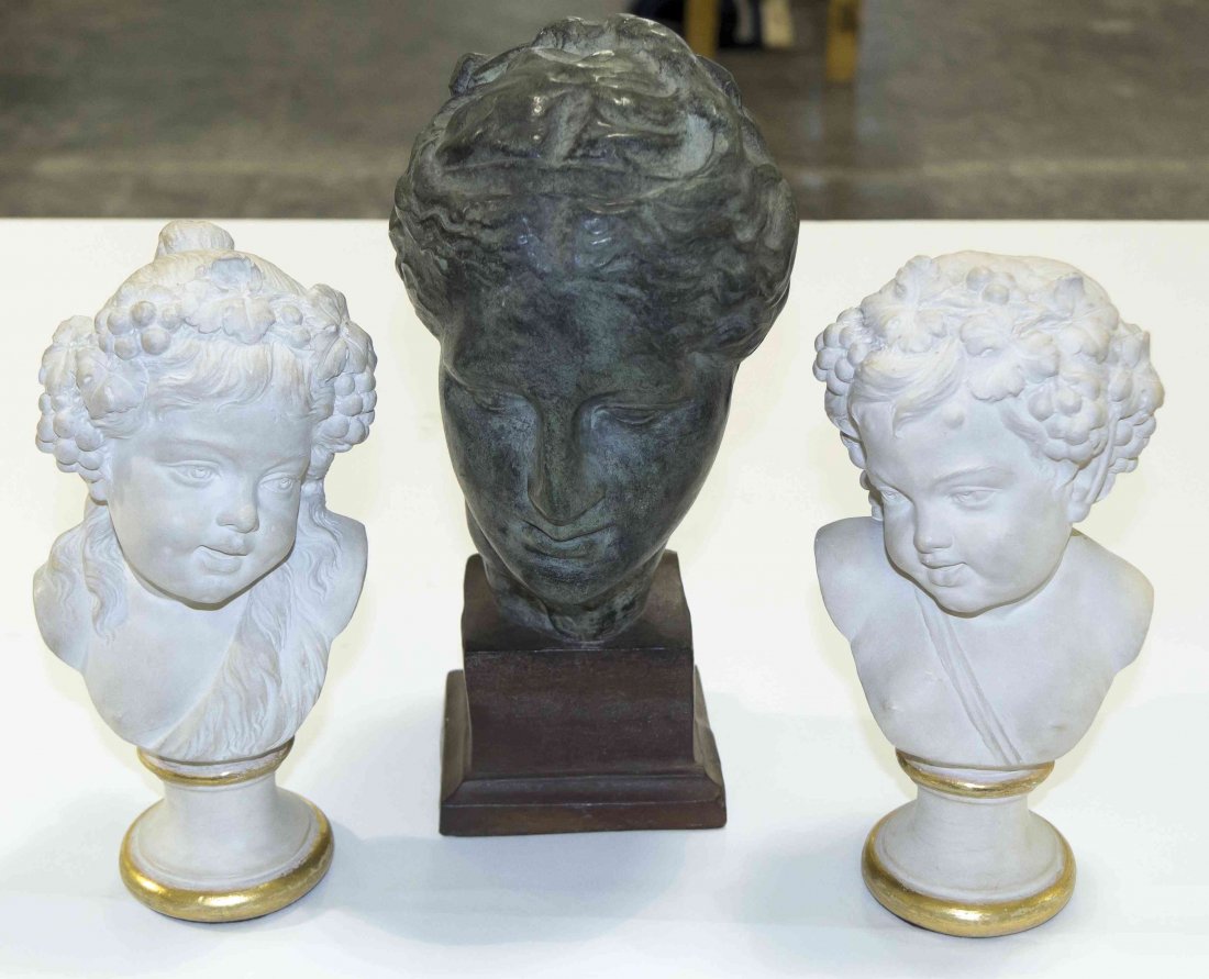 A Pair of Neoclassical Plaster Busts, Height of first 8: A Pair of Neoclassical Plaster Busts, depicting children with grape vine decoration, raised on gilt decorated socles, together with a bust of a maiden marked Made in Spain to base. Height of first 8 i