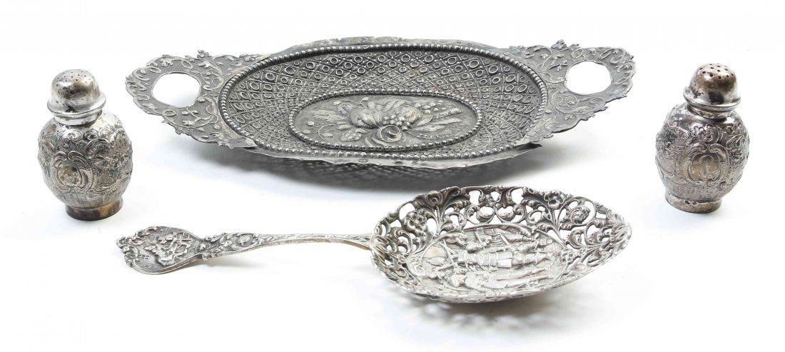 A Group of Continental Silver Table Articles, Late 19th: A Group of Continental Silver Table Articles, Late 19th Century, comprising a German two-handled tray, a pair of German casters, and a Dutch serving spoon; 12 ozt 3 dwt. Length of tray over handles 11