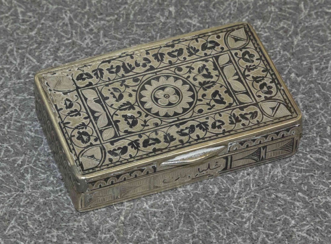 An Ottoman Silver and Enamel Snuff Box, 19th Century,: An Ottoman Silver and Enamel Snuff Box, 19th Century, rectangular, the hinged cover decorated with stylized flowerheads and scrolling foliage, the sides and base with Arabic inscriptions, apparently u