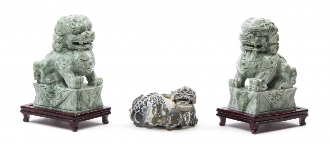 A Pair of Chinese Hardstone Fu Lions, Height of tallest: A Pair of Chinese Hardstone Fu Lions, together with a soapstone temple lion and pup. Height of tallest 6 inches.