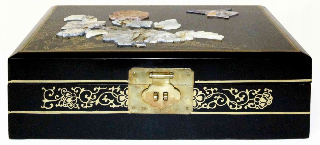 A Lacquer Jewelry Box, Width 12 3/4 inches.: A Lacquer Jewelry Box, of rectangular form, the lid with floral soapstone decoration, the whole with gilt highlights. Width 12 3/4 inches.
