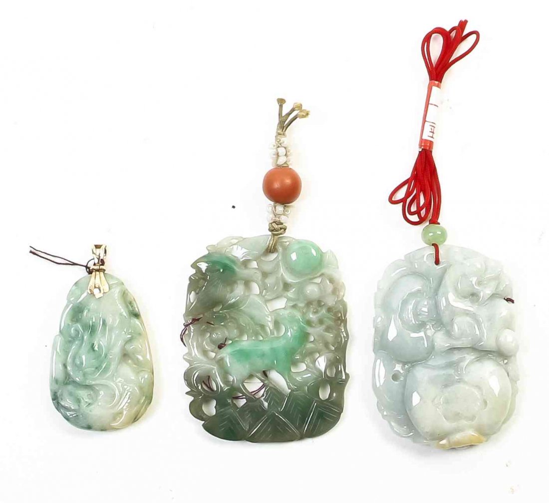 Three Carved Jade Pendants, Length of longest 2 inches.: Three Carved Jade Pendants, one having pierced decoration depicting a bird and a stag, the other two decorated with stylized animals. Length of longest 2 inches.