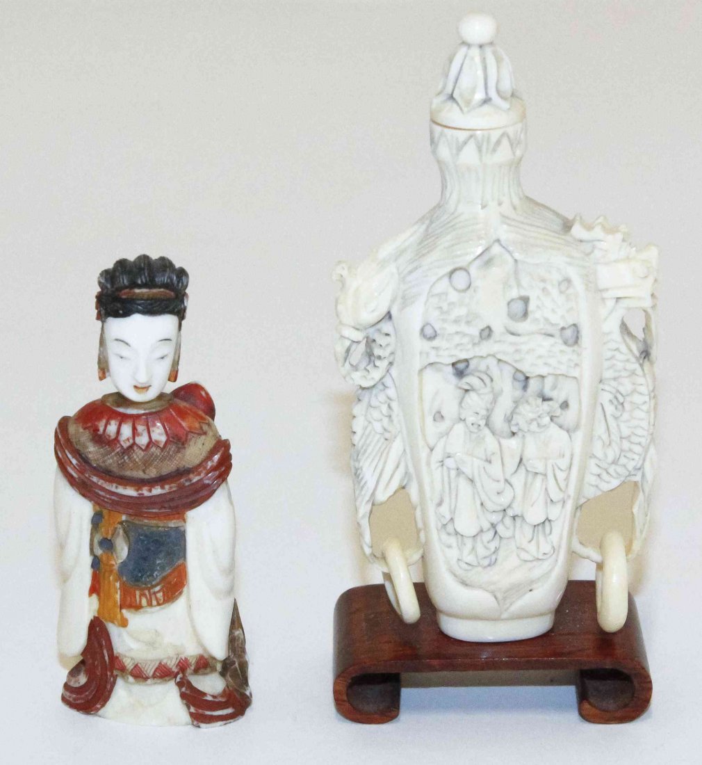Two Carved Ivory Chinese Snuff Bottles, Height of: Two Carved Ivory Chinese Snuff Bottles, the first in the form of a robbed figure with polychrome decoration, the second of bottle form with free-moving ring handles. Height of tallest overall 4 1/8 in