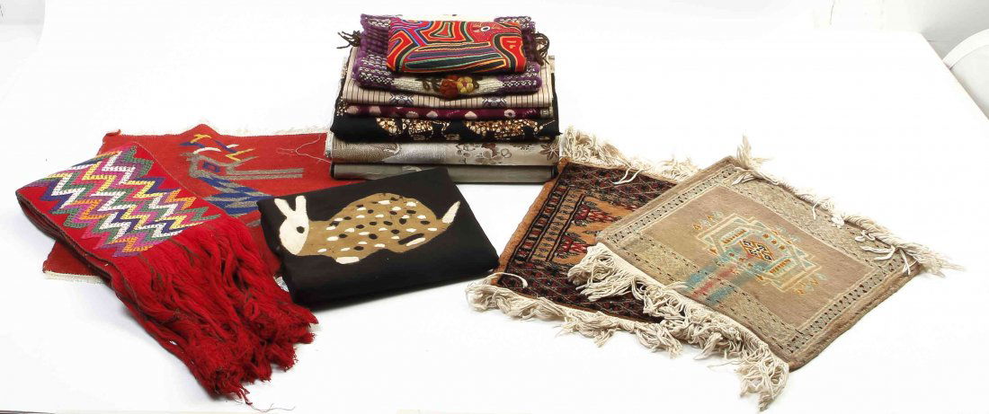 A Collection of Fifteen Textiles of Various Cultures,: A Collection of Fifteen Textiles of Various Cultures, comprising three Asian panels, two diminutive Pakistani rugs, a mola and nine others. Length of longest 143 1/2 inches. Property from the Estate o