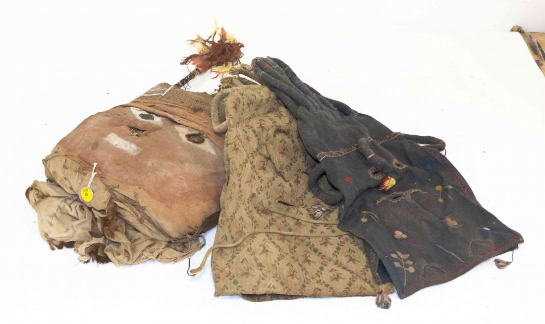 Three Ethnographic Masks, Length of longest 24 inches.: Three Ethnographic Masks, comprising two cloth head covers and a stuffed woven and burlap example with feather additions, the last retaining a lot sticker from Sotheby's Parke-Bernet. Length of longes