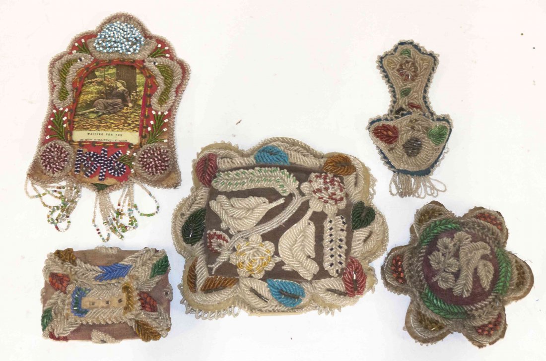 A Collection of Fifteen Iroquois Beaded Articles,: A Collection of Fifteen Iroquois Beaded Articles, of various forms, sizes and decoration, comprising pillows, picture frames and others. Length of longest 17 1/2 inches.