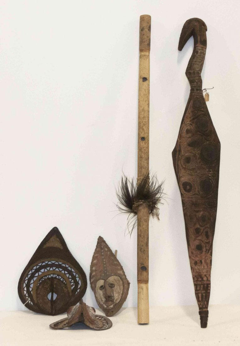 Five Oceanic Articles, Papau New Guinea, Length of: Five Oceanic Articles, Papau New Guinea, comprising three masks, a bamboo pipe and a carved wood ceremonial article. Length of longest 46 1/4 inches.