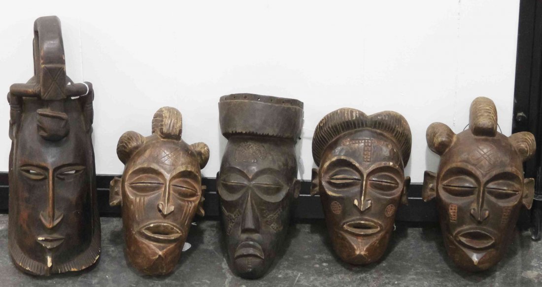 Five African Carved Masks, Height of tallest 15 1/2: Five African Carved Masks, comprising four Chokwe examples and a Dogon Mali example. Height of tallest 15 1/2 inches. Property from the Collection of Gerald F. Glaeve, Mount Horeb, Wisconsin