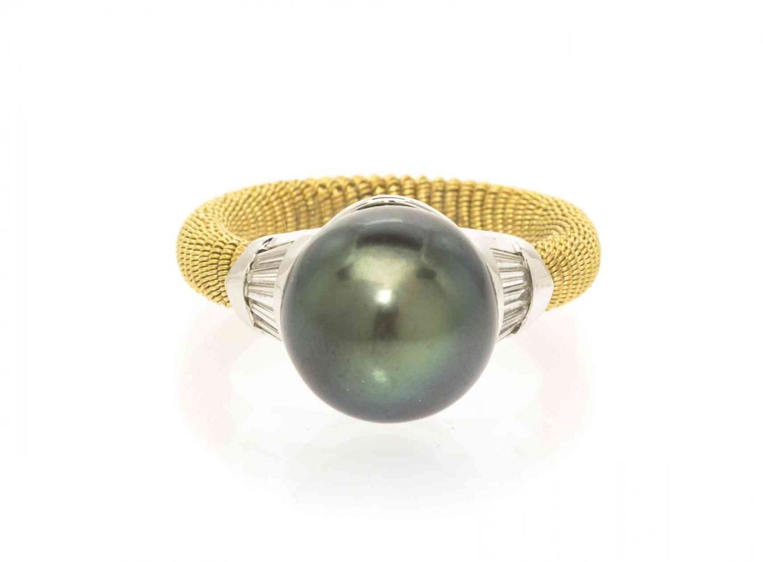 An 18 Karat Gold, Cultured Tahitian Pearl and Diamond: An 18 Karat Gold, Cultured Tahitian Pearl and Diamond Ring, Italian, containing one pearl measuring approximately 11.80 mm in diameter and 10 tapered baguette cut diamonds weighing approximately 0.30 