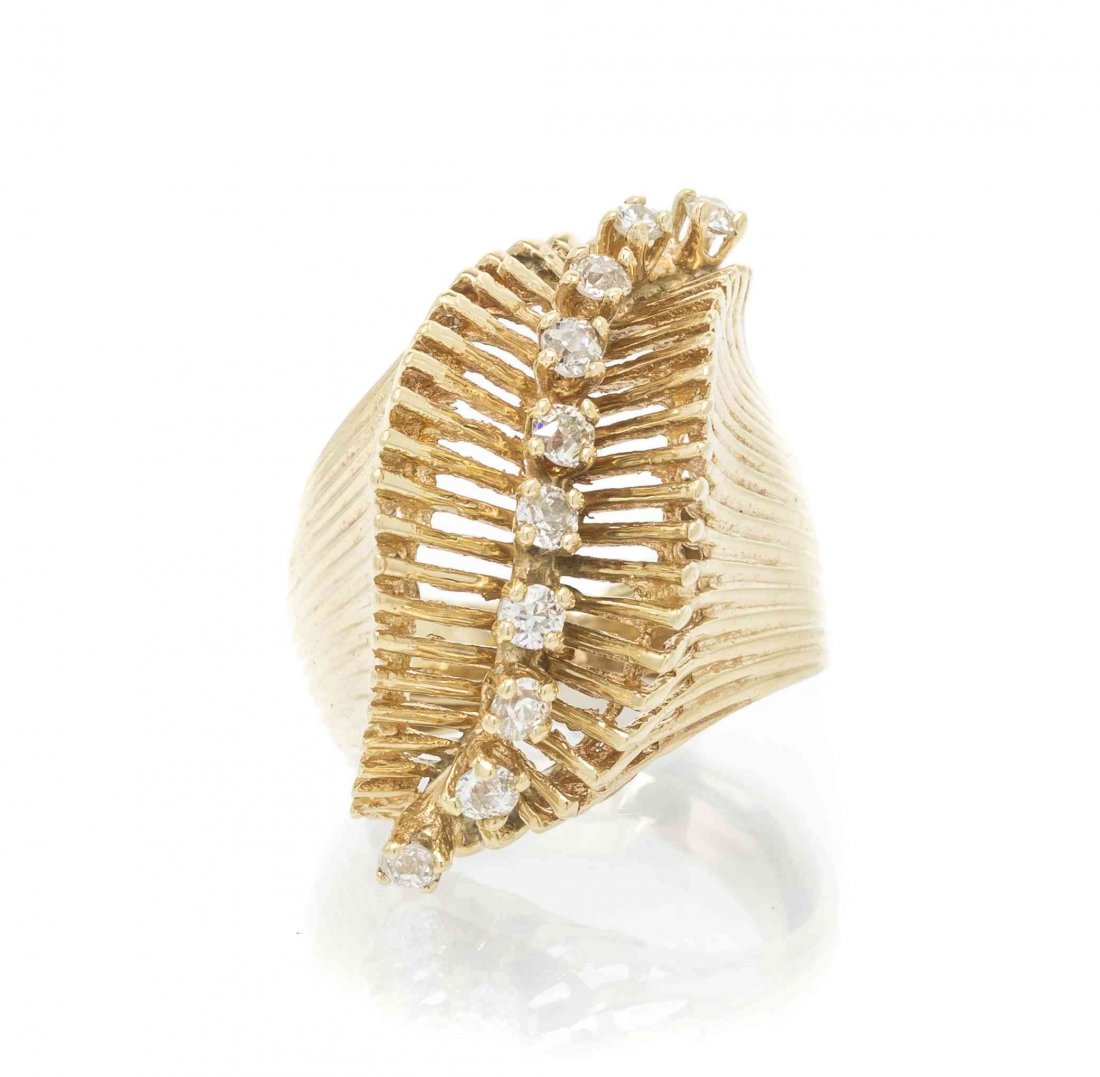 A 14 Karat Yellow Gold and Diamond Ring, 5.30 dwts.: A 14 Karat Yellow Gold and Diamond Ring, in an open wirework design, containing 10 round brilliant cut diamonds weighing approximately 0.18 carat total. 5.30 dwts. Property from the Estate of Martha S
