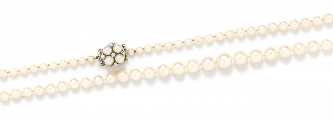 A Graduated Cultured Pearl Necklace, Circa 1945,: A Graduated Cultured Pearl Necklace, Circa 1945, consisting of 65 pearls measuring approximately 4.30-9.50 mm in diameter strung knotted with a circular cluster palladium clasp containing five round b
